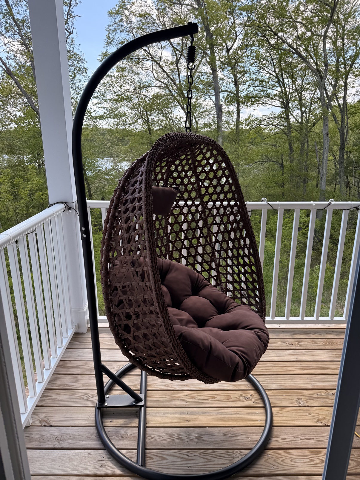 Hanging egg chair assembled on a porch