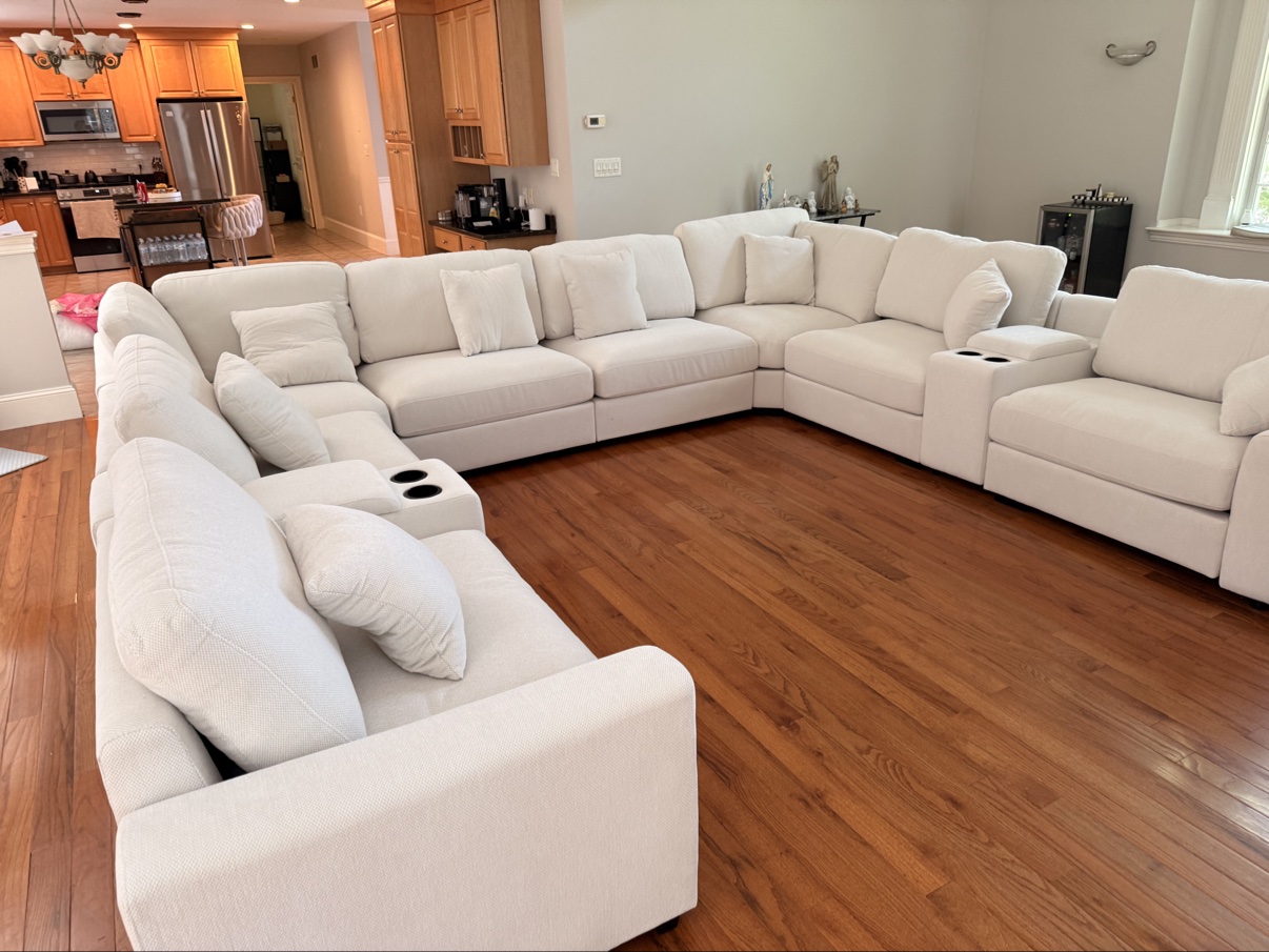 Large white sectional sofa assembled in living room